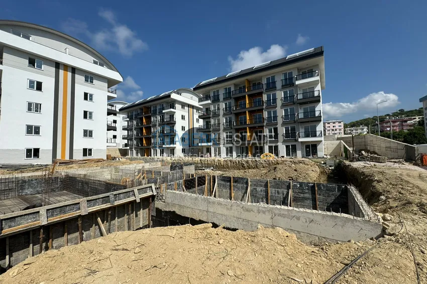 Фото - Двухкомнатная квартира в Окурджаларе в комплексе на этапе строительства в 150 метрах от моря 3 