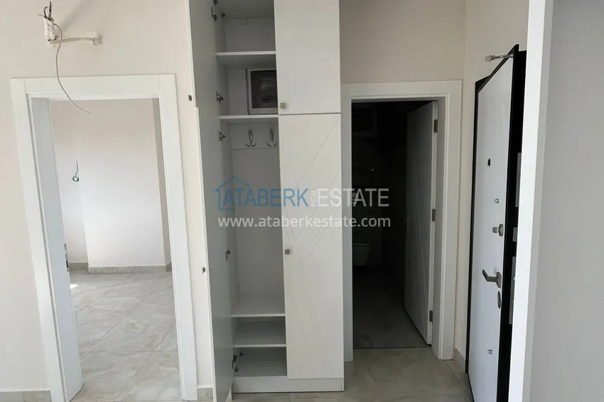 Приобрести Двухкомнатная квартира с открытым видом на море, район Махмутлар – Алания 4