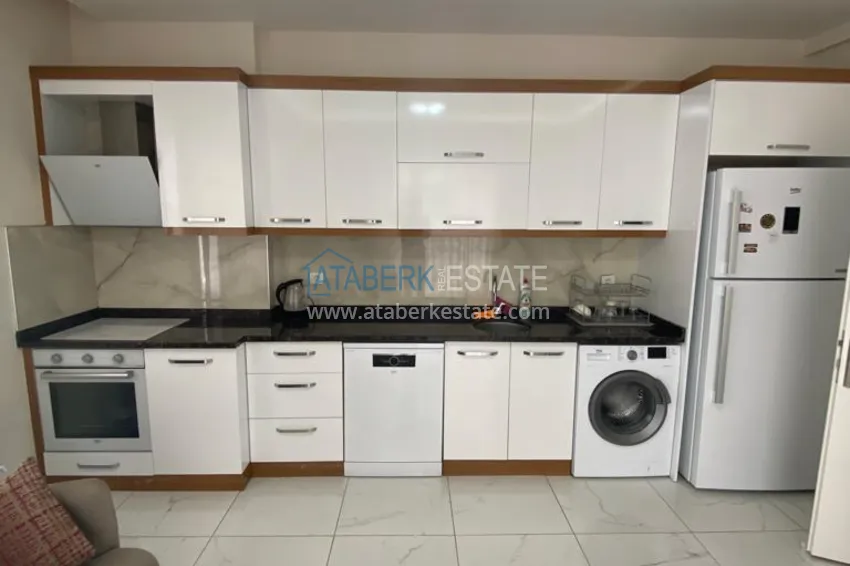 Приобрести Трехкомнатная квартира в Алании, район Оба в уютном комплексе городского типа 5 