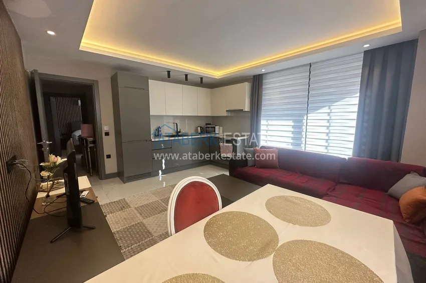 Приобрести Просторная двухкомнатная квартира с мебелью в центре Алании, район пляжа Клеопатра 6 