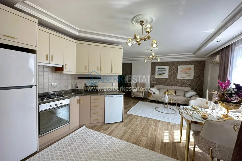 Приобрести Двухкомнатная квартира под ключ в уютном комплексе в Алании район Тосмур 7 