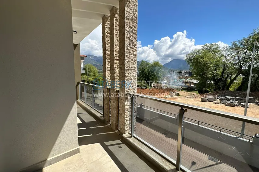 Приобрести Двухкомнатная квартира с видом на горы в Алании, район Оба 9 