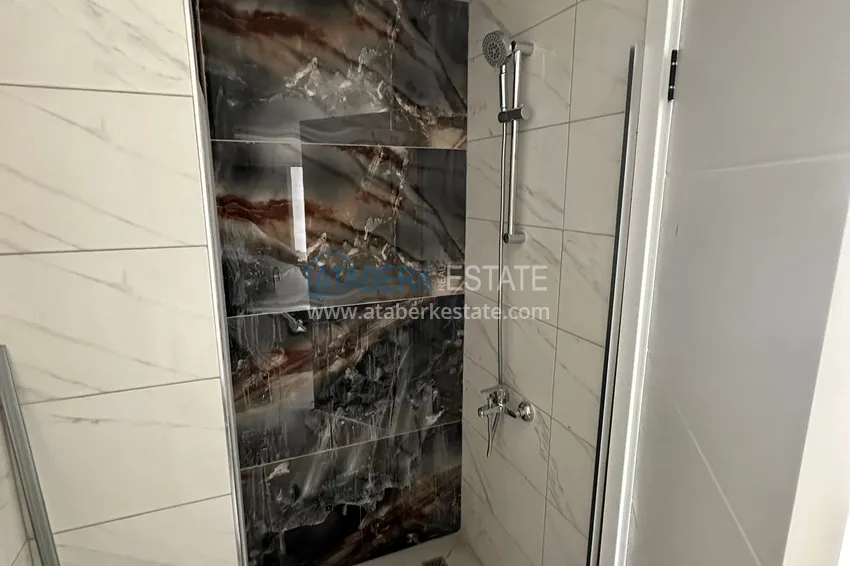 Приобрести Двухкомнатная квартира с чистовой отделкой в новом жилом комплексе - Махмутлар, Алания 9 