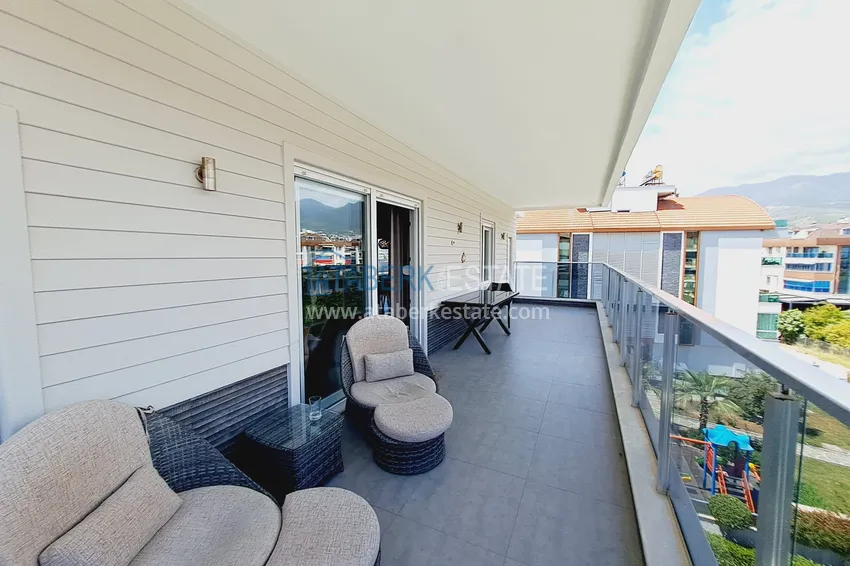 Приобрести Недвижимость под ВНЖ - Двухуровневый пентхаус с мебелью в Алании, район Оба 11 