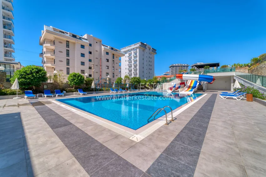 Трехкомнатная квартира под ключ в Махмутларе в современном комплексе 10 