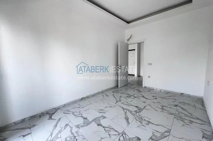 Приобрести Двухкомнатная квартира в новом комплексе комфорт-класса в районе Демирташ, Алания 12