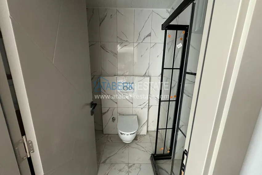 Приобрести Квартира 1+1 с видом на море в Мерсине – Арпачбахшиш, в комплексе на этапе завершения 12 