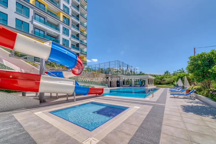 Трехкомнатная квартира под ключ в Махмутларе в современном комплексе 12 