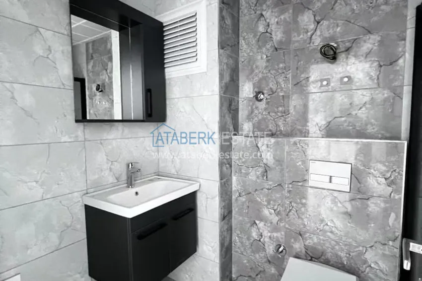 Приобрести Двухкомнатная квартира в новом комплексе комфорт-класса в районе Демирташ, Алания 13