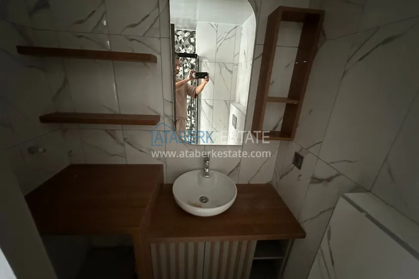 Приобрести Квартира 1+1 с видом на море в Мерсине – Арпачбахшиш, в комплексе на этапе завершения 13 