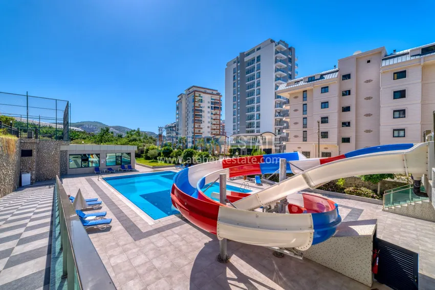 Трехкомнатная квартира под ключ в Махмутларе в современном комплексе 13 