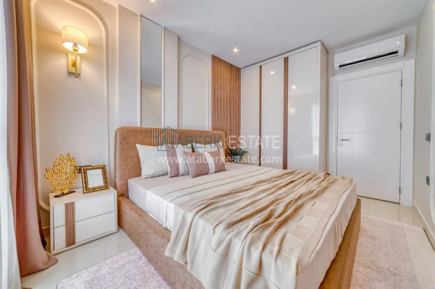 Приобрести Трехкомнатная квартира под ключ в Махмутларе в современном комплексе 13 