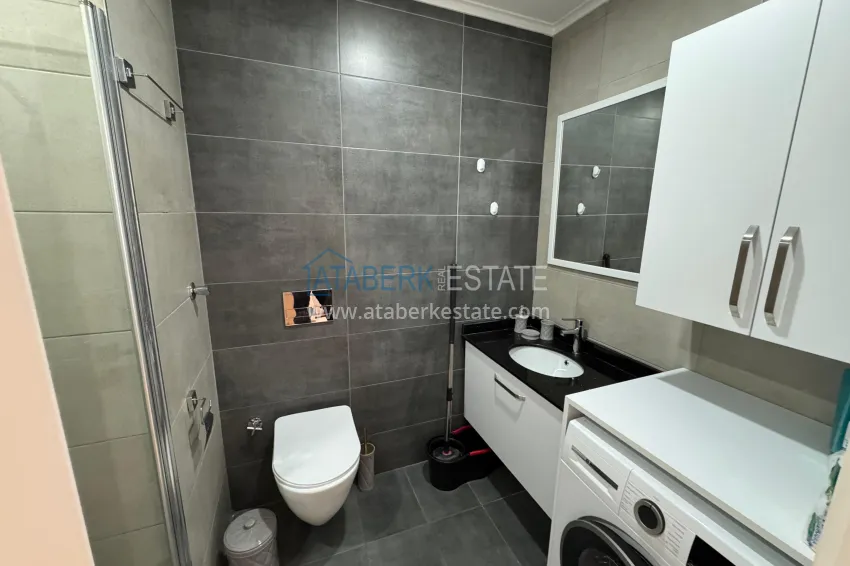 Приобрести Двухкомнатная квартира с мебелью и застекленным балконом в районе Махмутлар, Алания 15