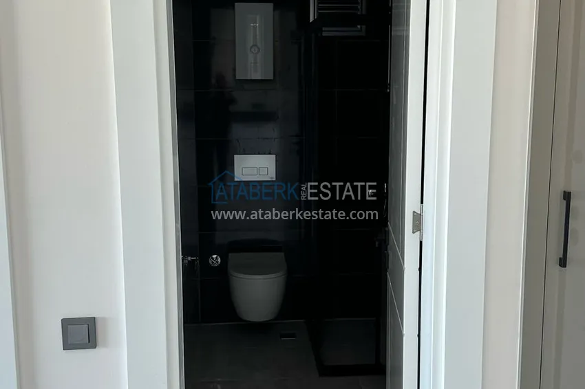 Приобрести Двухкомнатная квартира с видом на море в новом комплексе – Алания, район Авсаллар 12 