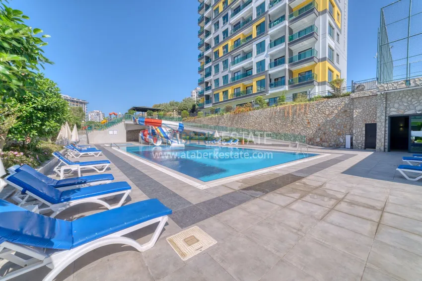 Трехкомнатная квартира под ключ в Махмутларе в современном комплексе 14 