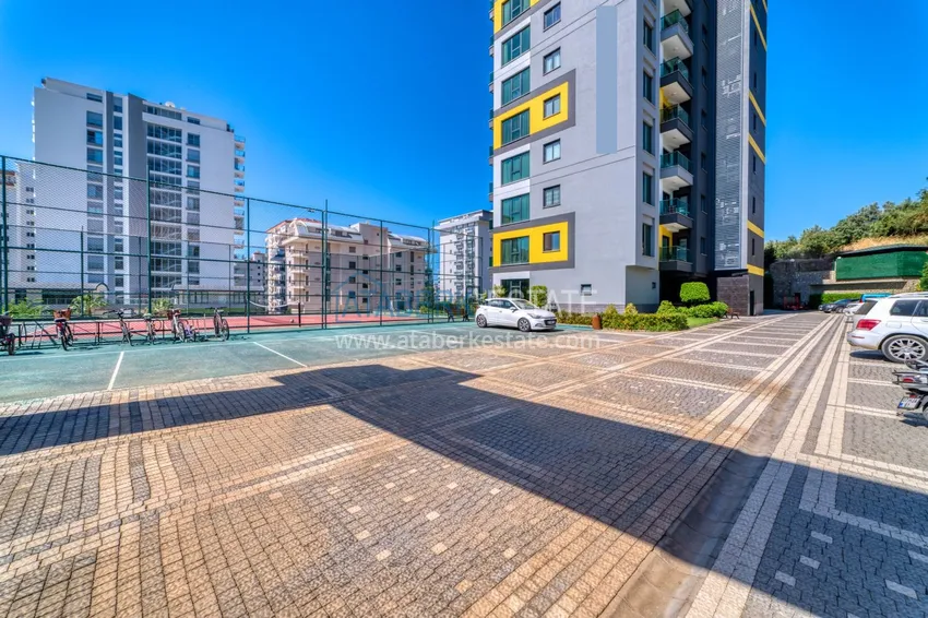 Трехкомнатная квартира под ключ в Махмутларе в современном комплексе 15 