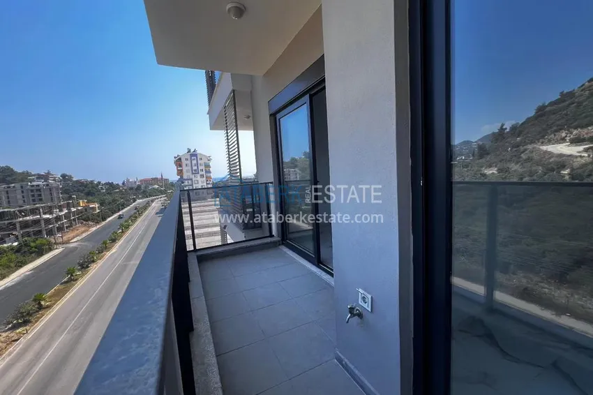 Приобрести Двухкомнатная квартира в новом комплексе комфорт-класса в районе Демирташ, Алания 16