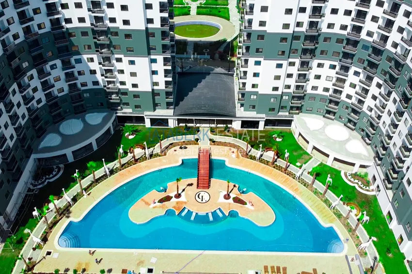 Меблированная двухкомнатная квартира в комплексе с отельной инфраструктурой, район Махмутлар – Алания 2 