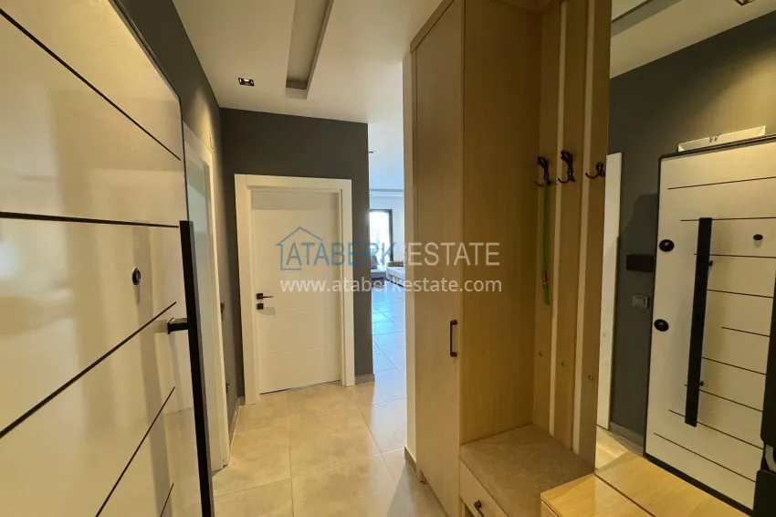 Приобрести Двухкомнатная квартира с мебелью и застекленным балконом в районе Махмутлар, Алания 1