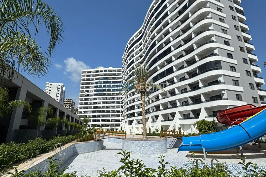 Двухкомнатная квартира с чистовой отделкой в Мерсине, район Эрдемли – Арпачбахшиш 1 