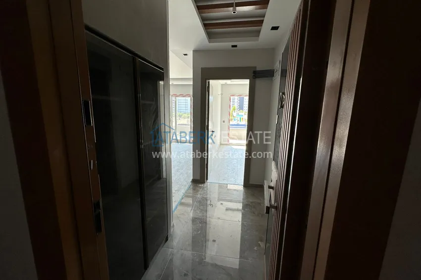 Приобрести Квартира 1+1 с видом на море в Мерсине – Арпачбахшиш, в комплексе на этапе завершения 1 