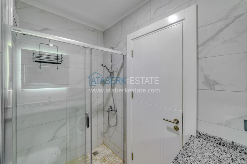 Приобрести Трехкомнатная квартира под ключ в Махмутларе в современном комплексе 21 