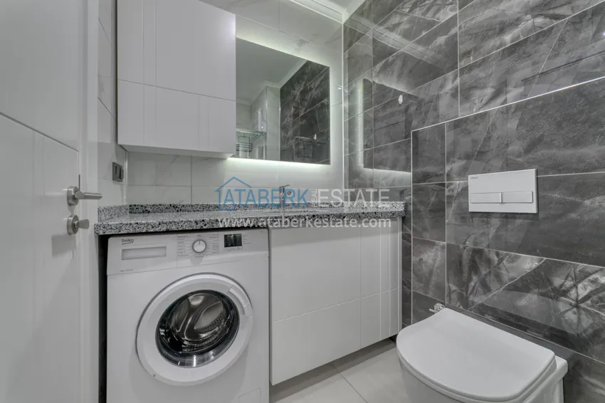 Приобрести Трехкомнатная квартира под ключ в Махмутларе в современном комплексе 22 