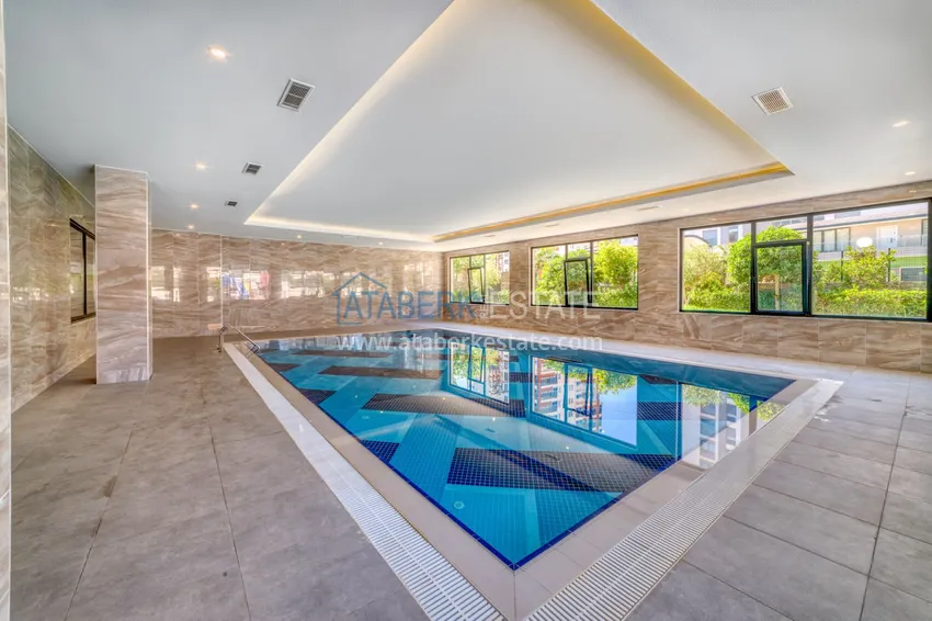 Трехкомнатная квартира под ключ в Махмутларе в современном комплексе 26 