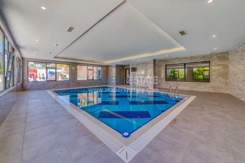 Трехкомнатная квартира под ключ в Махмутларе в современном комплексе 27 