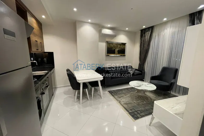 Приобрести Меблированная двухкомнатная квартира в комплексе с отельной инфраструктурой, район Махмутлар – Алания 2 