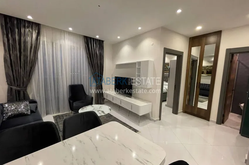 Приобрести Меблированная двухкомнатная квартира в комплексе с отельной инфраструктурой, район Махмутлар – Алания 3 