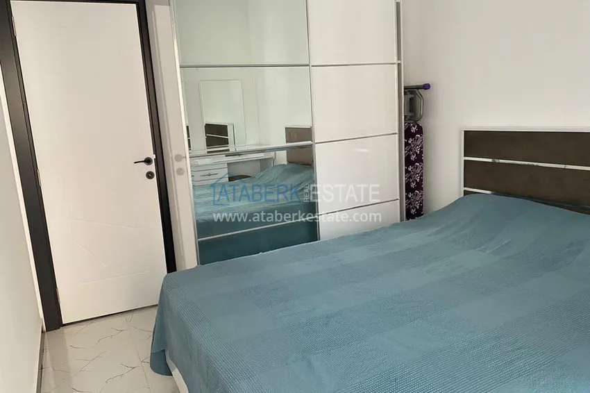 Приобрести Двухкомнатная квартира с мебелью в современном комплексе, район Авсаллар 4 