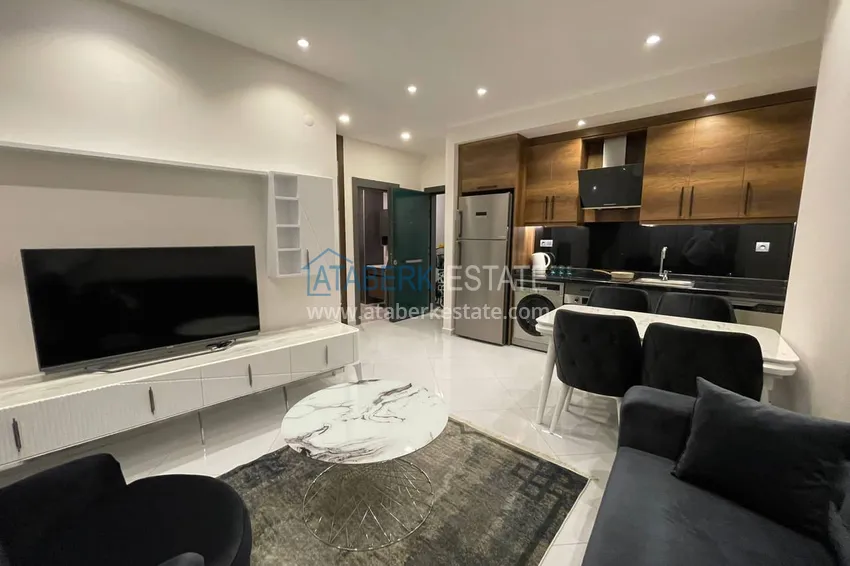 Приобрести Меблированная двухкомнатная квартира в комплексе с отельной инфраструктурой, район Махмутлар – Алания 4 