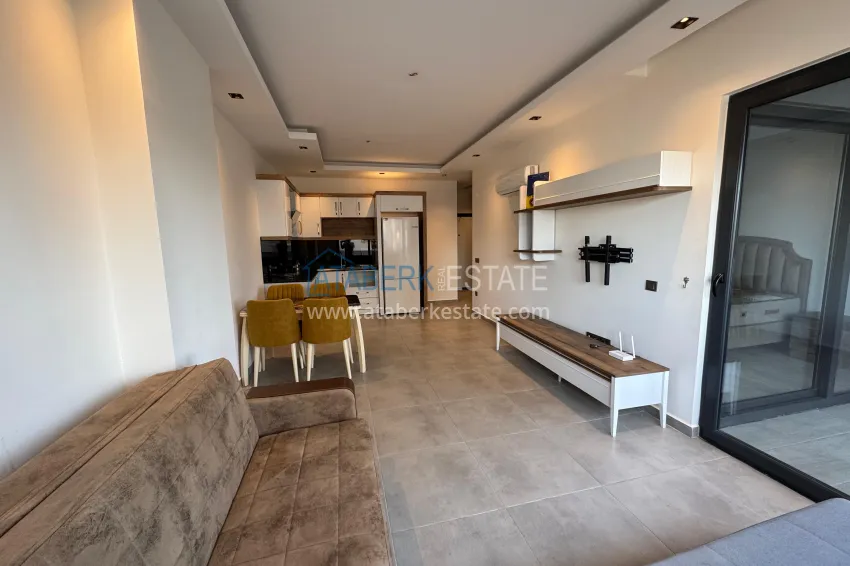 Приобрести Двухкомнатная квартира с мебелью и застекленным балконом в районе Махмутлар, Алания 4