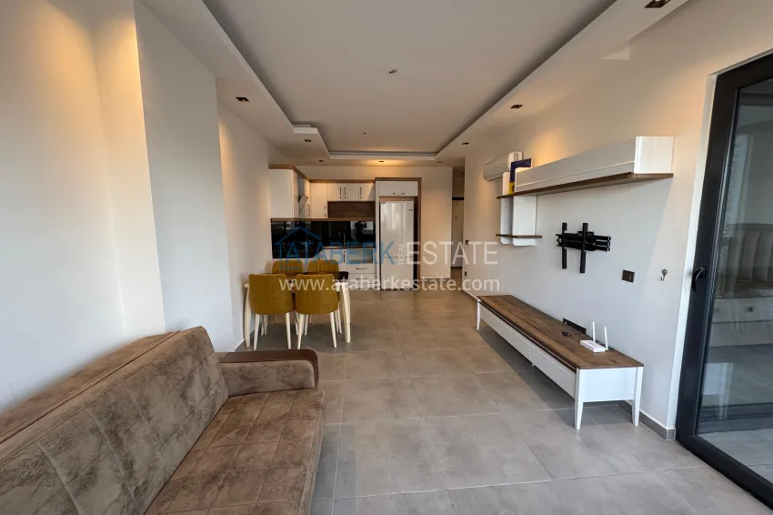 Приобрести Двухкомнатная квартира с мебелью и застекленным балконом в районе Махмутлар, Алания 5