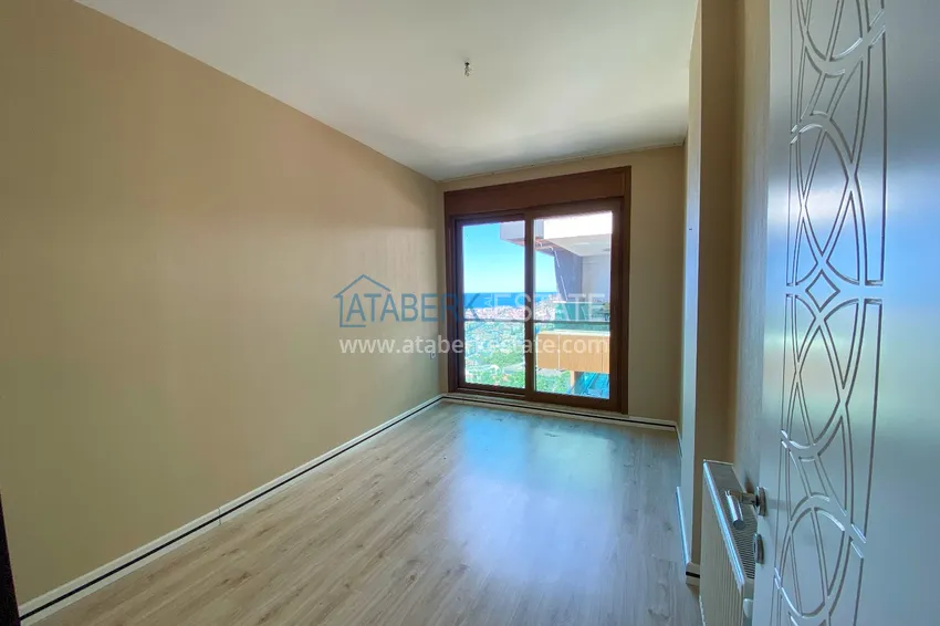 Приобрести Четырехкомнатная линейная квартира с отдельной кухней в центре Алании – Хасбахче 6 