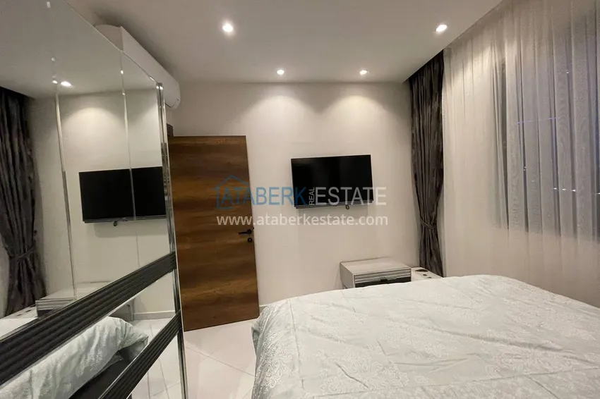 Приобрести Меблированная двухкомнатная квартира в комплексе с отельной инфраструктурой, район Махмутлар – Алания 6 