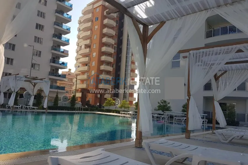 Трехкомнатная квартира с мебелью и отдельной кухней в районе Махмутлар 7 