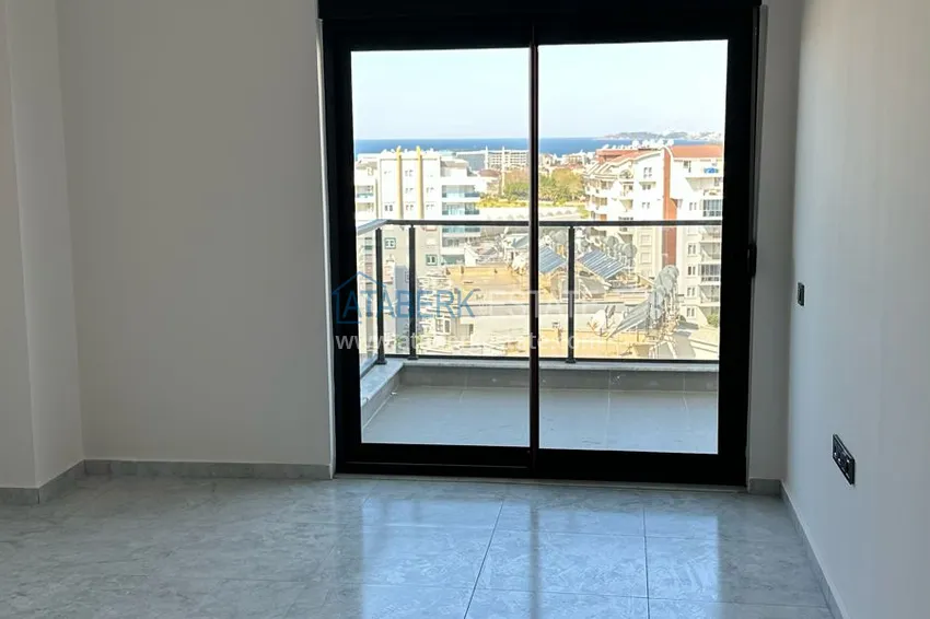 Приобрести Двухкомнатная квартира с видом на море в новом комплексе – Алания, район Авсаллар 7 