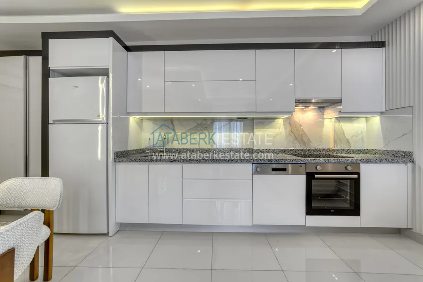 Приобрести Трехкомнатная квартира под ключ в Махмутларе в современном комплексе 9 