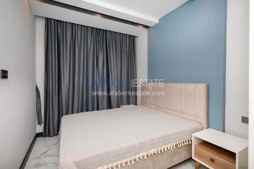 Приобрести Трехкомнатная квартира с мебелью в центре Махмутлара, район субботнего рынка 11