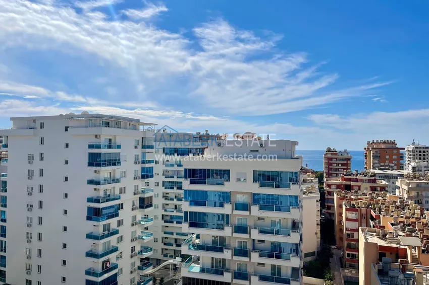 Приобрести Линейная четырехкомнатная квартира с мебелью и видом на море - Махмутлар 12 