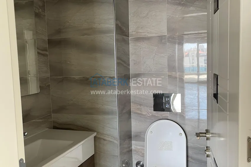 Приобрести Огромная квартира 1+1 площадью 110 м2 в центре района Махмутлар 12 