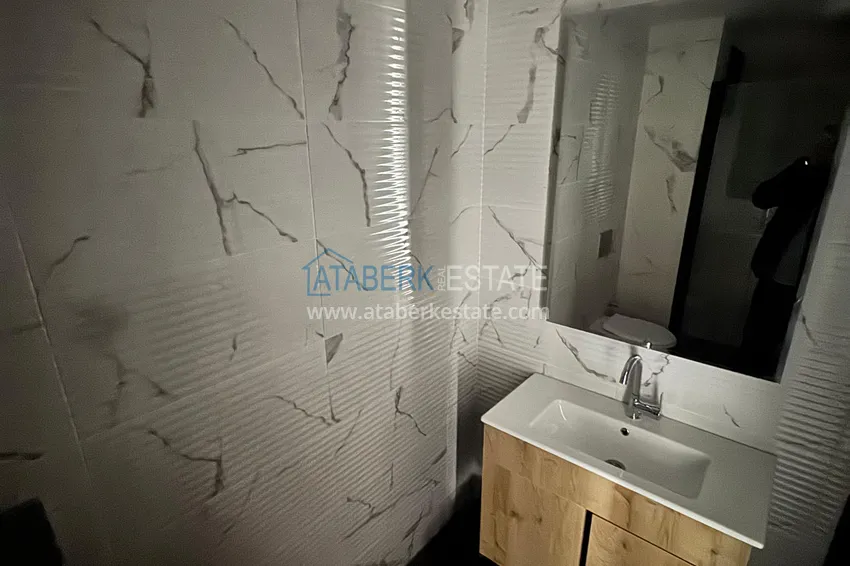 Приобрести Трехкомнатная квартира с видом на море и горы в современном комплексе – Мерсин, район Томюк 20 