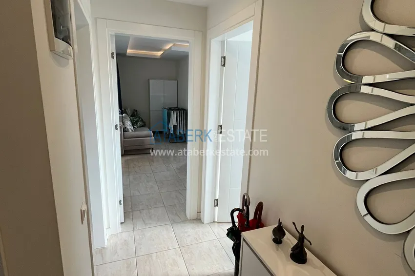 Приобрести Трехкомнатная квартира с мебелью в районе Оба в комфортабельном семейном комплексе 1