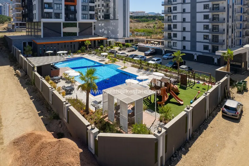 Двухкомнатная квартира с новой мебелью в центр Махмутлара, район субботнего рынка 4 