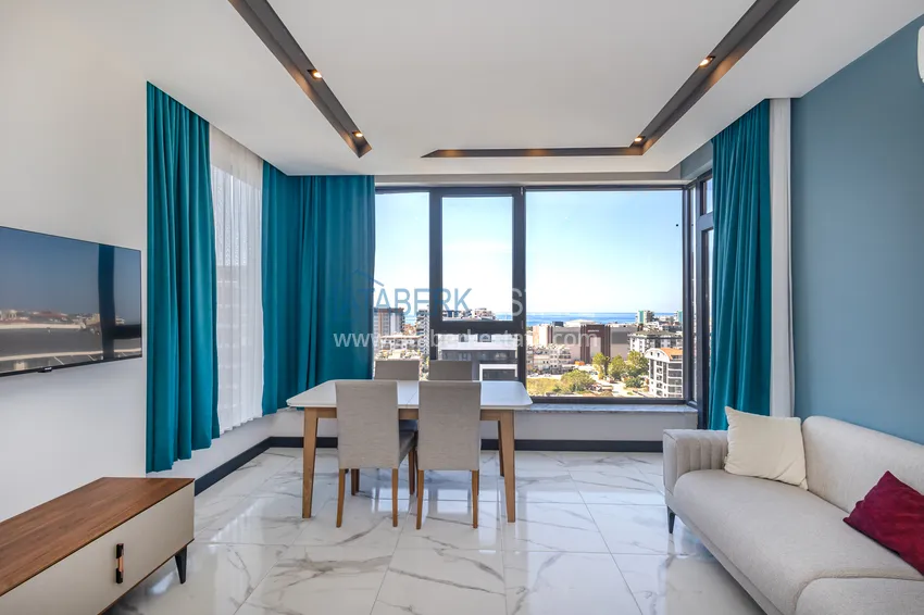 Приобрести Трехкомнатная квартира с мебелью в центре Махмутлара, район субботнего рынка 7