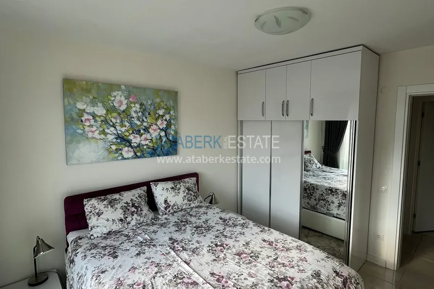 Приобрести Трехкомнатная квартира с мебелью в районе Оба в комфортабельном семейном комплексе 7