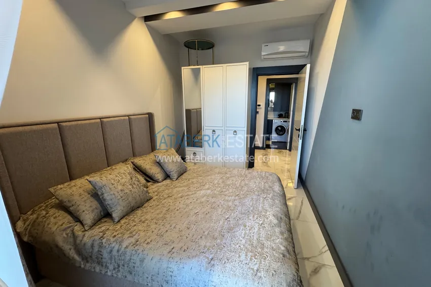 Приобрести Двухкомнатная квартира в центре Махмутлара – полностью готова к проживанию 8 