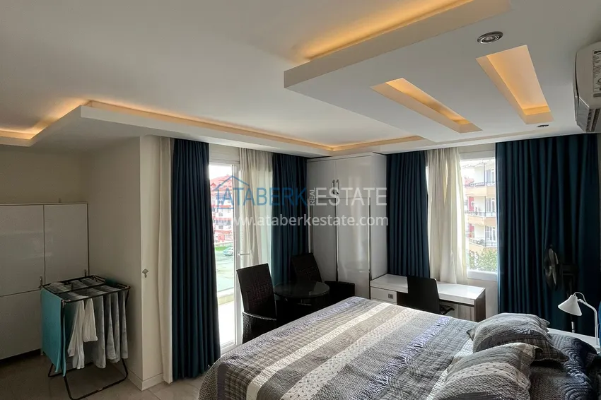 Приобрести Трехкомнатная квартира с мебелью в районе Оба в комфортабельном семейном комплексе 9